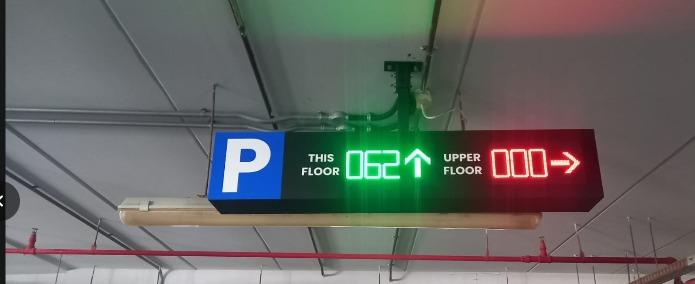 Parking guidance system - Indoor LED directional display showing THIS FLOOR 062 | UPPER FLOOR 000
